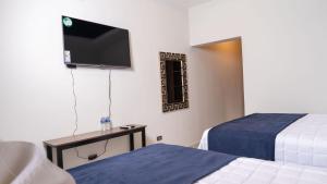 Postel nebo postele na pokoji v ubytování Hotel Boutique Nueva Valladolid