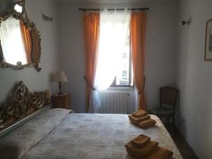 Posteľ alebo postele v izbe v ubytovaní L'antica dimora con splendida vista sul Pantheon