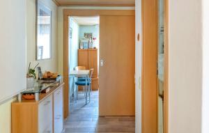 a kitchen with a door open to a kitchen with a table at Ferienwohnung Mirow in Mirow