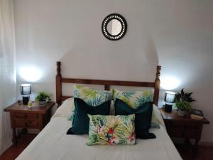 a bedroom with a bed with pillows and a mirror at MASIA Del ROC DE SANT CAIETA in Roda de Bará +52 photos