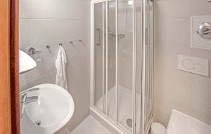 a bathroom with a shower and a toilet and a sink at Ferienwohnung Ueckermünde in Ueckermünde +6 photos