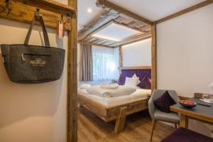 Voodi või voodid majutusasutuse Hotel Bergkristall toas