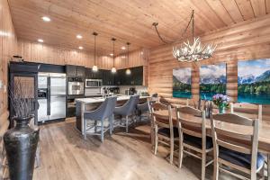 a kitchen and dining room with a table and chairs at Deer Valley Luxury 3 BR, Private Master Suite, Private Hot Tub, Amazing Views in Park City