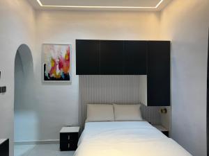 Voodi või voodid majutusasutuse Five Palms Studio Apartment toas