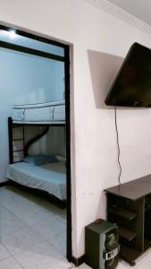 Ένα ή περισσότερα κρεβάτια σε δωμάτιο στο Casa Vacacional en Conjunto Privado - Flandes, Tolima