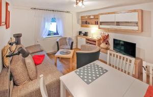 a living room with a couch and a table at Ferienwohnung Malchow in Malchow