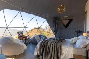 Voodi või voodid majutusasutuse Aura - Glamping Experience toas