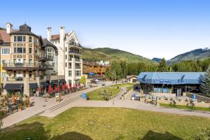a street in a town with buildings and a park at Lion Square Lodge East 310A in Vail