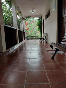an empty hallway with a bench in a building at Chalés Xibayka Ilhabela in Ilhabela +62 photos