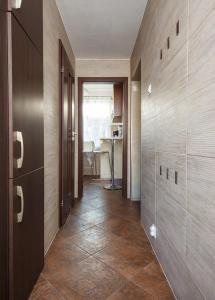 a hallway with wooden walls and a table in a room at Plac Uniwersytecki 15B in Wrocław +26 photos