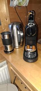 a coffee maker sitting on top of a counter at Cabin Dakota in Ermelo +16 photos
