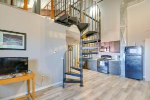 a spiral staircase in a room with a kitchen at Del Norte Getaway 35 Mi Wolf Creek Ski Area! in Del Norte