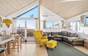 a living room with a couch and a table at Stunning Home In Haderslev With Wifi in Haderslev