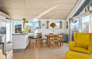 a kitchen and dining room with a table and chairs at Stunning Home In Haderslev With Wifi in Haderslev