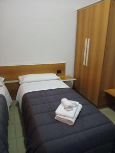 Postel nebo postele na pokoji v ubytování Hotel Ponsacco HP