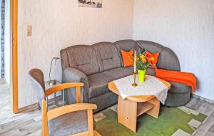 a living room with a couch and a table at Ferienwohnung Kloster in Kloster