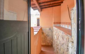 an external view of a room with a staircase in a house at Pet Friendly Apartment In Solanas in Solanas