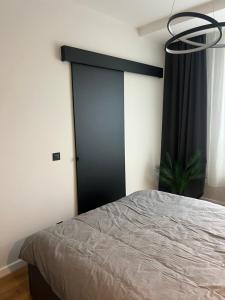 Postel nebo postele na pokoji v ubytování Apartament NP