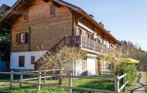 a wooden house with a fence in front of it at Nice Home In Careggine With Wifi in Careggine +17 photos
