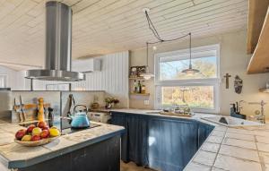 a kitchen with a bowl of fruit on a counter at 3 Bedroom Cozy Home In Nibe in Nibe