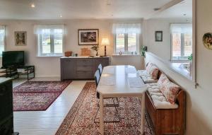 a living room with a couch and a table at 3 Bedroom Beautiful Home In Fevik in Fevik