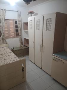 Ένα ή περισσότερα κρεβάτια σε δωμάτιο στο Casa aconchegante próximo praia