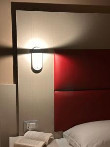 A bed or beds in a room at Hotel City 20