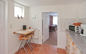 a kitchen with a table and a counter top at Ferienwohnung Patzig Auf Rügen in Patzig
