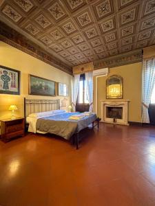 a bedroom with a bed and a coffered ceiling at Dimora '800 in Ferrara +20 photos