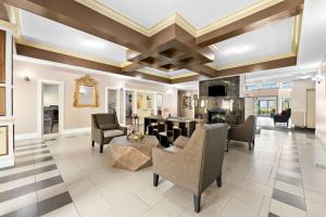 a living room with a coffered ceiling and furniture at Best Western Williams Lake in Williams Lake