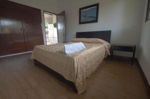 Postel nebo postele na pokoji v ubytování Tacuara Hotel