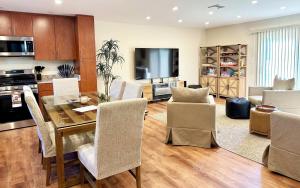 a dining room and living room with a table and chairs at Saugerties Waterfront Getaway in Saugerties