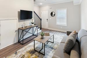 a living room with a couch and a table at Biltmore Luxury 1513 #8 Townhomes L 2bd 2 Bth in Clarksville