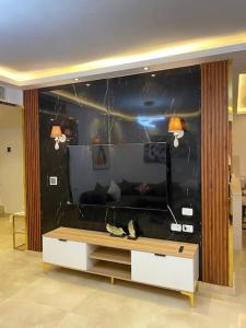 a living room with a large black wall at Elegant Beach Villa Sharm in Sharm El Sheikh
