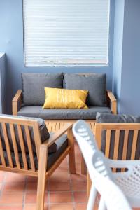 Coin salon dans l'établissement Appartements avec vue mer à Tartane