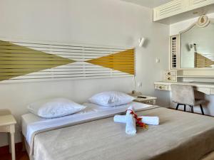 Un ou plusieurs lits dans un hébergement de l'établissement Appartements avec vue mer à Tartane