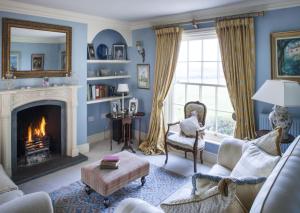 a living room with a fireplace and a couch at Brills Farm in Lincoln