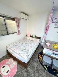 Kama o mga kama sa kuwarto sa 糖果屋 岸里玉出