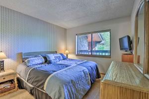 a bedroom with a bed and a tv in it at Mountainside Royalview Condo: Pool/Hot Tubs, Great Location in Frisco +29 photos