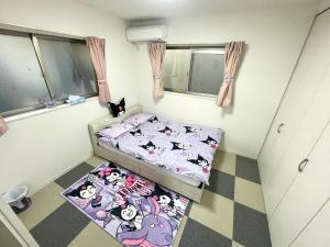 Postel nebo postele na pokoji v ubytování 糖果屋 岸里玉出