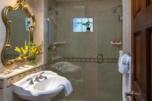a bathroom with a sink and a shower at The Eagle Inn in Santa Barbara +138 photos