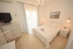 Posteľ alebo postele v izbe v ubytovaní Apartments Lucky