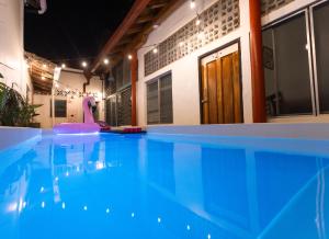 a swimming pool with a pink flamingo in a house at Hostel De Boca en Boca in Granada