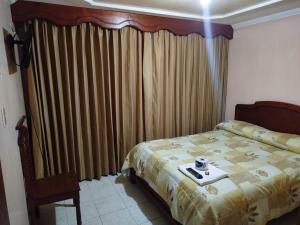 Hotel El Dorado Guatavita客房内的一张或多张床位