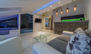 a living room with a couch and a fireplace at Morning Wood - Skylight in Belgrade