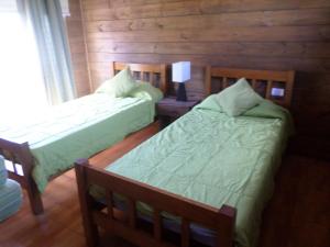 Postel nebo postele na pokoji v ubytování Cabañas Del Faro + 27 fotografií