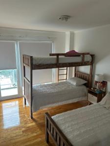 Ένα ή περισσότερα κρεβάτια σε δωμάτιο στο Departamento 3 amb zona Güemes con cochera cubierta