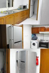 Una cocina con electrodomésticos blancos y gabinetes de madera. en Luxury Room for Single gent غرفة خاصة لشاب واحد, en Sharjah