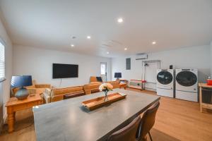 a living room with a table and a couch at Naples Duplex Home with Private Pool and Lanai! in Naples
