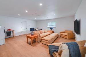a living room with a couch and chairs and a tv at Naples Duplex Home with Private Pool and Lanai! in Naples